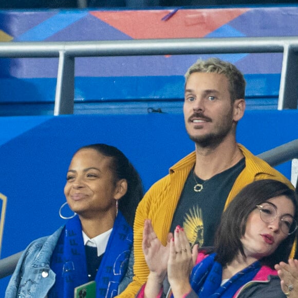 M. Pokora (Matt Pokora), sa femme Christina Milian assistent au match de la 5ème et avant-dernière journée de Ligue des nations entre la France et l'Autriche (2-0) au Stade de France à Saint-Denis le 22 septembre 2022.