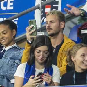 M. Pokora (Matt Pokora), sa femme Christina Milian assistent au match de la 5ème et avant-dernière journée de Ligue des nations entre la France et l'Autriche (2-0) au Stade de France à Saint-Denis le 22 septembre 2022.