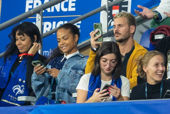 M. Pokora (Matt Pokora), sa femme Christina Milian assistent au match de la 5ème et avant-dernière journée de Ligue des nations entre la France et l'Autriche (2-0) au Stade de France à Saint-Denis le 22 septembre 2022.