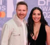 David Guetta et sa compagne Jessica Ledon au photocall de la soirée des BRIT Awards à l'O2, Peninsula Square de Londres, Royaume Uni.