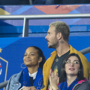 M. Pokora (Matt Pokora), sa femme Christina Milian assistent au match de la 5ème et avant-dernière journée de Ligue des nations entre la France et l'Autriche (2-0) au Stade de France à Saint-Denis le 22 septembre 2022. 