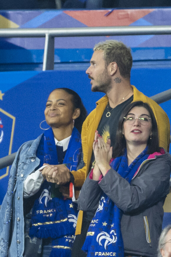 M. Pokora (Matt Pokora), sa femme Christina Milian assistent au match de la 5ème et avant-dernière journée de Ligue des nations entre la France et l'Autriche (2-0) au Stade de France à Saint-Denis le 22 septembre 2022. 