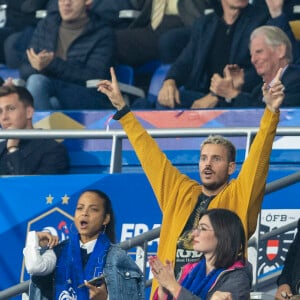 M. Pokora (Matt Pokora), sa femme Christina Milian assistent au match de la 5ème et avant-dernière journée de Ligue des nations entre la France et l'Autriche (2-0) au Stade de France à Saint-Denis le 22 septembre 2022. 