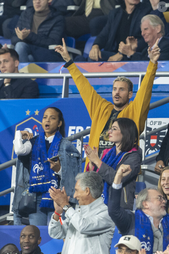 M. Pokora (Matt Pokora), sa femme Christina Milian assistent au match de la 5ème et avant-dernière journée de Ligue des nations entre la France et l'Autriche (2-0) au Stade de France à Saint-Denis le 22 septembre 2022. 