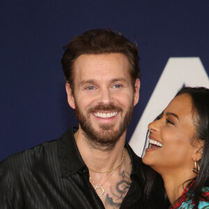 Matt Pokora et sa femme Christina Milian au photocall lors de la première du film "Ambulance" à Los Angeles le 4 avril 2022. 