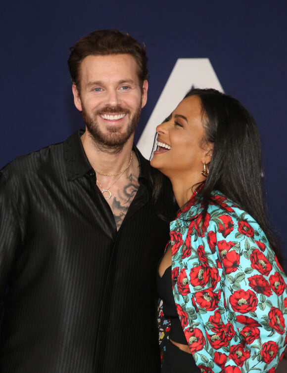 Matt Pokora et sa femme Christina Milian au photocall lors de la première du film "Ambulance" à Los Angeles le 4 avril 2022. 