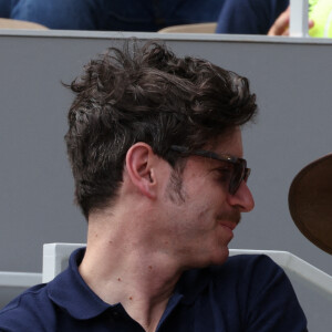 Grégory Nicolaidi, Elodie Frégé en tribunes lors des Internationaux de France de tennis de Roland Garros à Paris, France, le 26 mai 2022.