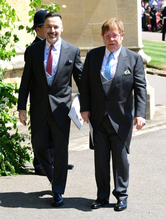 David Furnish et Elton John à la sortie de la chapelle St. George au château de Windsor lors du mariage de Meghan et Harry, Royaume Uni, le 19 mai 2018.
