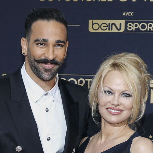 Adil Rami et sa compagne Pamela Anderson au photocall de la 28ème cérémonie des trophées UNFP (Union nationale des footballeurs professionnels) au Pavillon d'Armenonville à Paris, France.