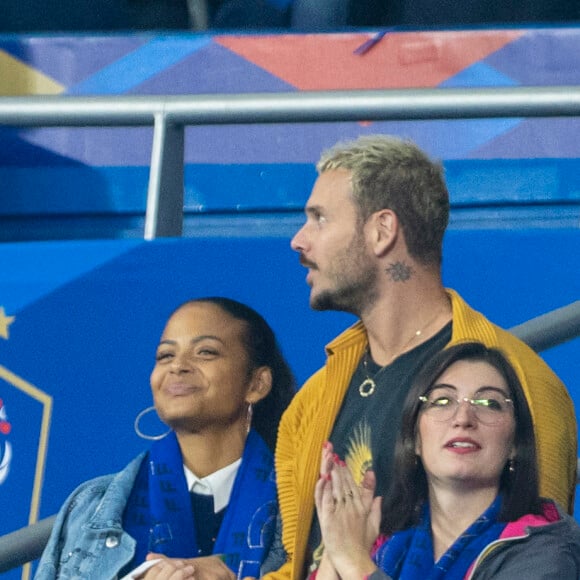 M. Pokora (Matt Pokora), sa femme Christina Milian assistent au match de la 5ème et avant-dernière journée de Ligue des nations entre la France et l'Autriche (2-0) au Stade de France à Saint-Denis le 22 septembre 2022. 