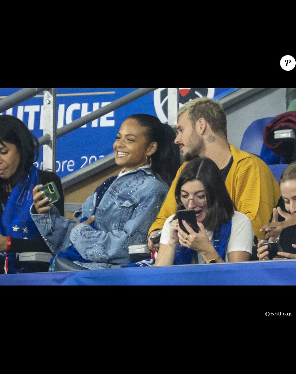 M. Pokora (Matt Pokora), sa femme Christina Milian assistent au match de la 5ème et avant-dernière journée de Ligue des nations entre la France et l'Autriche (2-0) au Stade de France à Saint-Denis le 22 septembre 2022.
