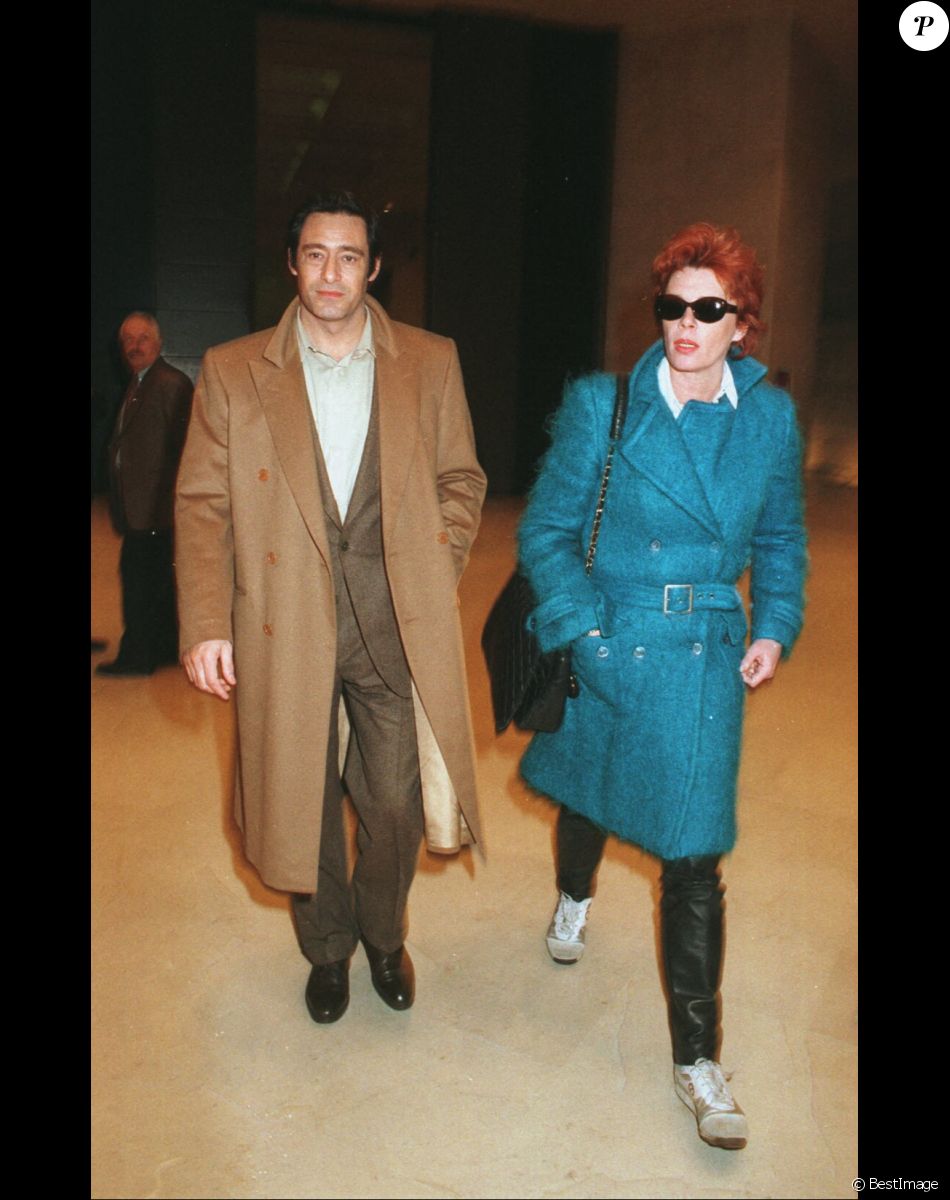 Gérard Lanvin et sa femme Jennifer lors d'un défilé de mode en 1996
