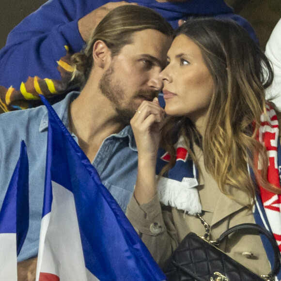 Camille Cerf (Miss France 2015) et son compagnon Théo Fleury - People dans les tribunes lors du match de la 5ème et avant-dernière journée de Ligue des nations entre la France et l'Autriche (2-0) au Stade de France à Saint-Denis le 22 septembre 2022.