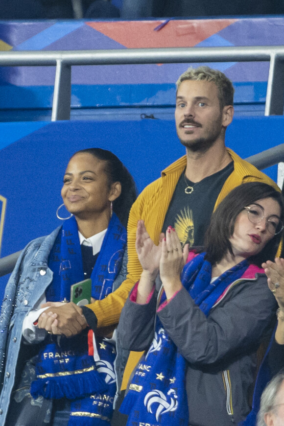 M. Pokora (Matt Pokora), sa femme Christina Milian assistent au match de la 5ème et avant-dernière journée de Ligue des nations entre la France et l'Autriche (2-0) au Stade de France à Saint-Denis le 22 septembre 2022.