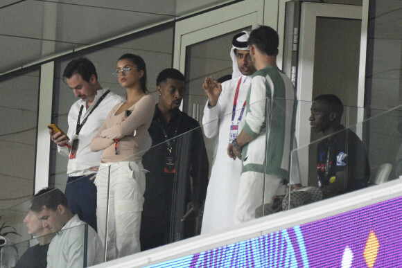 Presnel Kimpembe Nasser al-Khelaïfi (président du PSG), Pierre Gasly dans les tribunes du match "France - Australie (4-1)" lors de la Coupe du Monde 2022 au Qatar, le 22 novembre 2022.