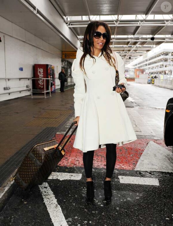 Mel B et son mari Stephen Belafonte à leur arrivée à Londres le 16 février 2010