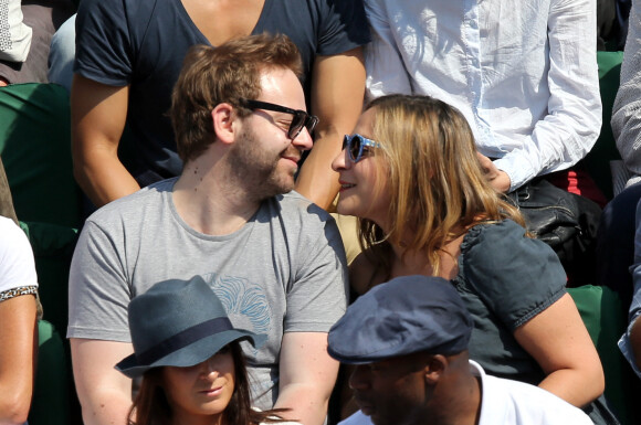 Marilou Berry et Arnaud Schneider assistent aux Internationaux de France de tennis de Roland Garros à Paris, le 31 mai 2014.