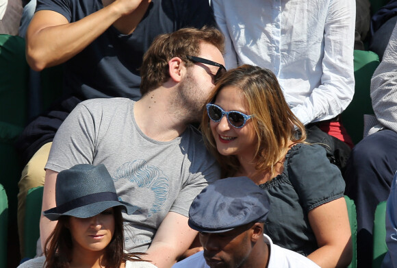 Marilou Berry et Arnaud Schneider assistent aux Internationaux de France de tennis de Roland Garros à Paris, le 31 mai 2014.