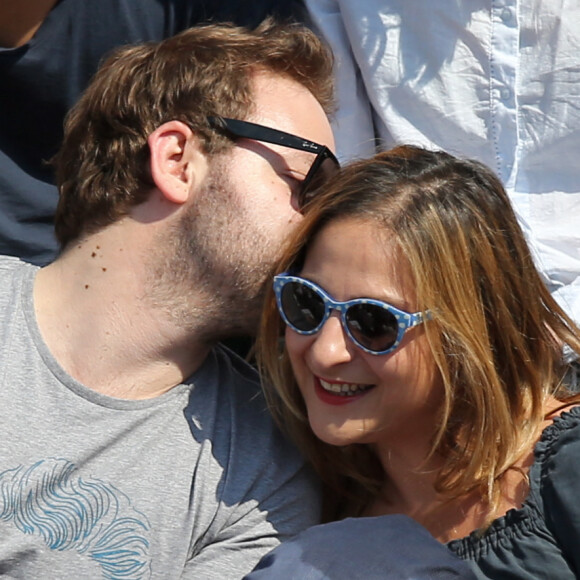 Marilou Berry et Arnaud Schneider assistent aux Internationaux de France de tennis de Roland Garros à Paris, le 31 mai 2014.