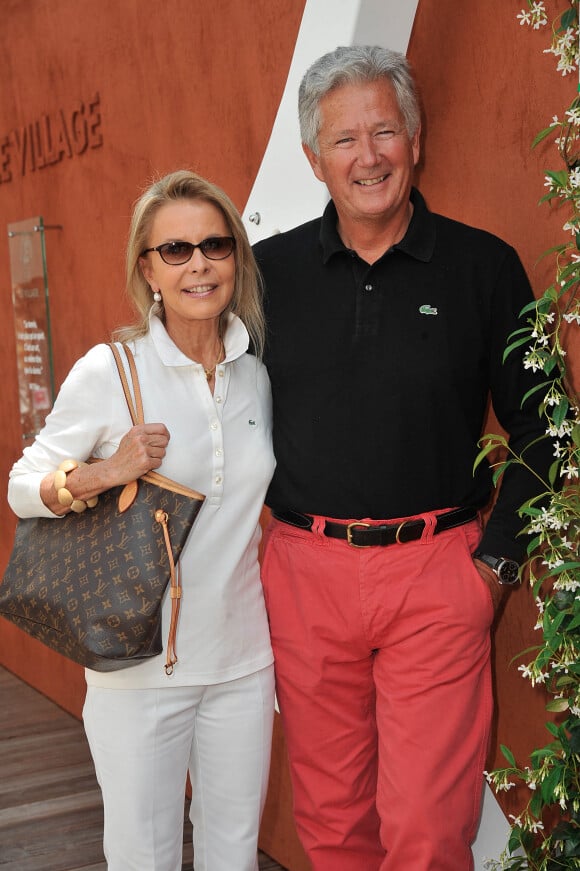 Pierre Dhostel et sa femme Carole Bellemare au village des Internationaux de France de tennis de Roland Garros à Paris, le 7 juin 2014.