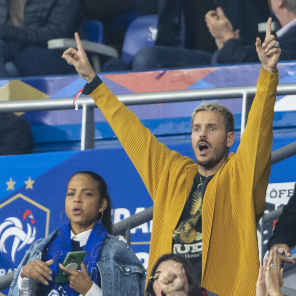 M. Pokora (Matt Pokora), sa femme Christina Milian assistent au match de la 5ème et avant-dernière journée de Ligue des nations entre la France et l'Autriche (2-0) au Stade de France à Saint-Denis le 22 septembre 2022. 