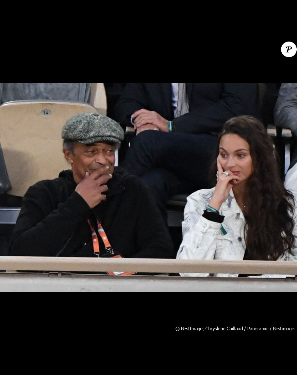 Yannick Noah et sa fille Jenaye Noah - Célébrités dans les tribunes des internationaux de France de Roland Garros à Paris le 30 mai 2022.