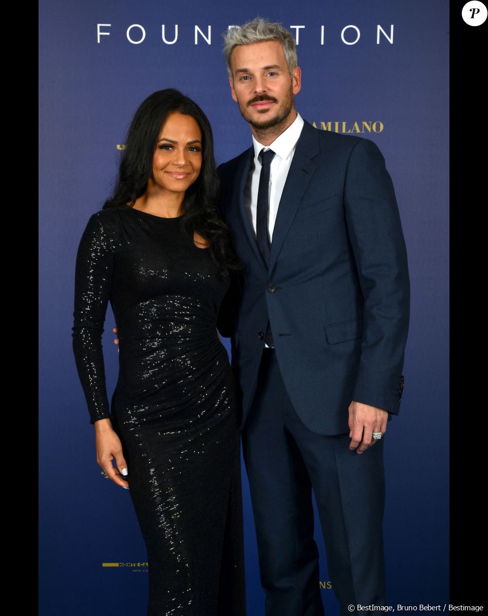 Restée à Los Angeles et donc loin de son chéri, sur scène avec une autre, Christina Milian ne s'est pas laissé abattre.
Exclusif - Christina Milian et son mari M. Pokora (Matt Pokora) - Photocall du gala annuel de la Fondation Elina Svitolina au Yacht Club de Monaco. Le 2 décembre 2022 © Bruno Bebert / Bestimage Le vendredi 2 décembre 2022, la Fondation Elina Svitolina a organisé une vente aux enchères lors de son dîner de gala annuel, qui s'est tenu pour la première fois au Monaco Yacht Club. Les fonds récoltés lors de cette soirée, placée sous le Haut Patronage de Son Altesse Sérénissime le Prince Albert II de Monaco, serviront à financer les programmes mis en place par la Fondation depuis 2019 dont le programme de relance du tennis ukrainien d'après-guerre, mais aussi à poursuivre la soutien logistique et matériel apporté aux familles des bénéficiaires durement touchés par la guerre en Ukraine. Parmi les invités de marque d'Elina Svitolina-Monfils pour l'événement, sachez que nous sommes vraiment heureux d'accueillir : • A.Schevchenko (légende du football ukrainien), • T.Parker (Champion NBA et All-Star Player de France), • G.Monfils (joueur de tennis français et ancien numéro 8 mondial) • M.Harnois (médaillée olympique en taekwondo) • T.Miroshnechenko (présentateur de télévision ukrainien) • L.Nikitiuk (présentatrice de télévision ukrainienne) • M.Pokora et C.Milian • C.Botino • A. Karembeu • F.DAURE : Délégué aux Relations avec la Principauté de Monaco et Subdélégué au Contrôle de gestion • A.Popovchenko • M.de.Passy " J'organise le dîner de gala annuel de ma Fondation à un moment très difficile pour mon pays... Pour moi, c'est l'occasion de rappeler une fois de plus à tous que la guerre continue ", déclare Elina Svitolina. "Mon objectif est de rassembler ceux qui soutiennent l'Ukraine et de trouver de nouveaux amis et partenaires pour ma Fondation, qui travaille à la fois pour soutenir les enfants talentueux et pour développer le tennis. L'équipe et moi-même croyons fermement à la victoire et pensons déjà à la restauration d'après-guerre des infrastructures sportives. Les jeunes talents qui ont fui le pays à cause de la guerre doivent savoir qu'ils seront bientôt les bienvenus chez eux ". Plus d'une quinzaine de lots exceptionnels ont été proposés au cours de la soirée qui a réuni des invités internationaux du monde du sport et du spectacle, réunis pour l'occasion autour de la championne ukrainienne pour soutenir sa Fondation et ses actions. Cette soirée, placée sous le signe de la solidarité et du sport, était l'occasion de faire le point sur les actions mises en place en 2022 par la Fondation mais aussi de rencontrer des sportifs engagés lors d'un cocktail et d'un dîner dans l'un des lieux les plus emblématiques de la France : La Principauté de Monaco.