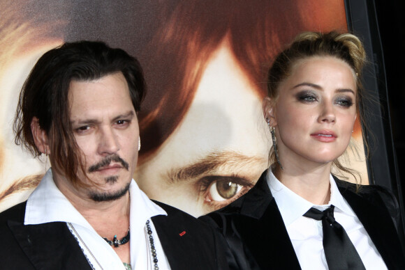 Pour rappel, l'actrice accusait son ex de violences conjugales. Johnny Depp l'avait attaquée en diffamation pour des déclarations qu'il affirmait fausses et aux répercussions importantes sur sa carrière
Johnny Depp et sa femme Amber Heard - Première de "The Danish Girl" au théatre Westwood village à Westwood le 21 novembre 2015. 