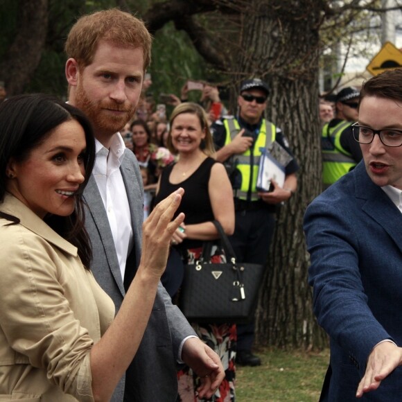 Le prince Harry, duc de Sussex, et Meghan Markle, duchesse de Sussex, visitent l'école primaire "Albert Park" à Melbourne, le 18 octobre 2018. 