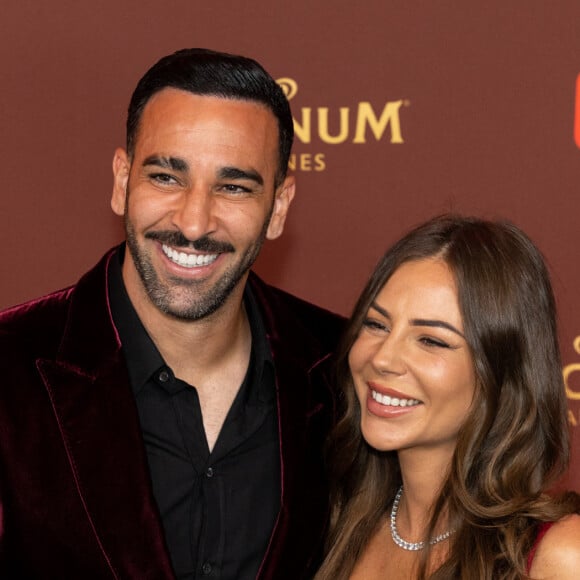 Adil Rami et sa compagne Léna Guillou - Soirée sur la plage Magnum lors du 76e Festival International du Film de Cannes le 22 mai 2023. © Philippe Baldini/Bestimage