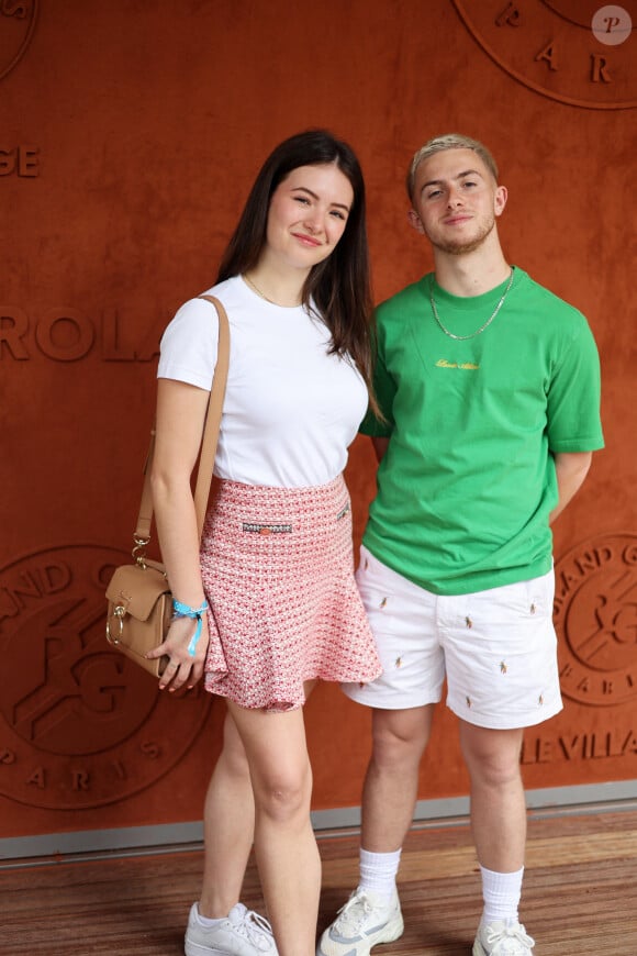 Michou et sa compagne Elsa Bois - Célébrités au Village lors des Internationaux de France de tennis de Roland Garros 2023 à Paris le 10 juin 2023. © Jacovides-Moreau/Bestimage 