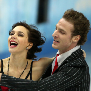 Malgré leur séparation, Nathalie Péchalat et Fabian Bourzat ont continué à former un couple sur la glace
Les patineurs français Nathalie Pechalat et Fabian Bourzat lors de l'épreuve du programme court par en couple en patinage au Iceberg Skatiing Palace à Sotchi le 8 février 2014 pendant XXIIème jeux olympiques d'hiver.
