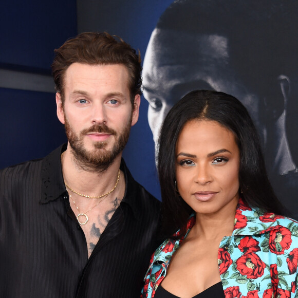 Christina Milian et son mari Matt Pokora au photocall de la première du film "Ambulance" à Los Angeles le 4 avril 2022. 