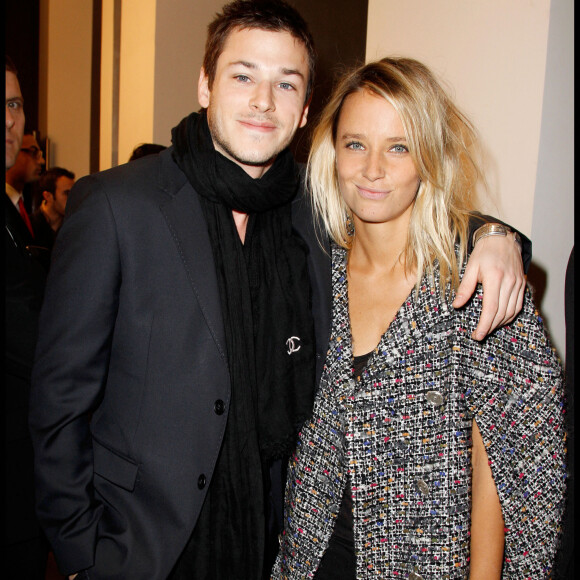 Gaspard Ulliel et Jordane Crantelle - People au défilé haute-couture Chanel printemps-été 2011 à Paris.