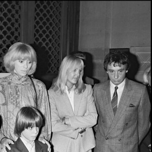 Archives - Romain Sardou lors de son baptême en présence de ses parents Babette et Michel Sardou, de son parrain Alain Delon et de Mireille Darc en 1982. ©Bestimage