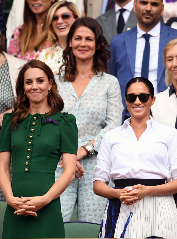 Catherine (Kate) Middleton, duchesse de Cambridge, Meghan Markle, duchesse de Sussex, et Pippa Middleton dans les tribunes lors de la finale femme de Wimbledon "Serena Williams - Simona Halep (2/6 - 2/6) à Londres, le 13 juillet 2019.