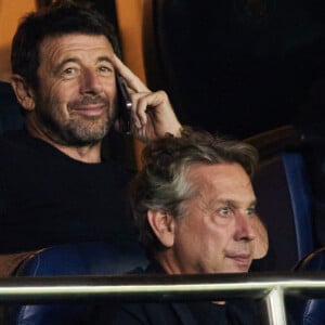 Patrick Bruel dans les tribunes du match de Ligue des champions entre le PSG et le Borussia Dortmund (2-0) au Parc des Princes à Paris le 19 septembre 2023. © Cyril Moreau/Bestimage