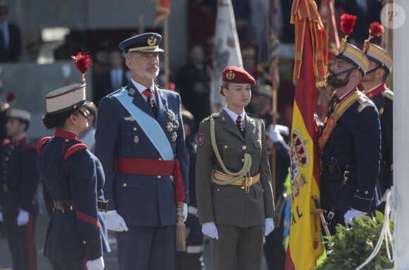 The Princess of Asturias, Leonor and King Felipe VI during the parade on October 12 'National Day', at the Plaza de Canovas del Castillo, on October 12, 2023, in Madrid (Spain). The events begin with the raising of the national flag and the tribute to those who gave their lives for Spain, followed by air and ground parades of different units in which 4,177 military personnel participate. This year is the first year in which a woman unfurls the flag by parachute. The parade changes its route and the Royal Tribune is now located in the Plaza de Neptuno. In addition, Leonor de Borbón, immersed in her military training as a cadet lady, wears her uniform after two years of absence due to her studies in Wales. 