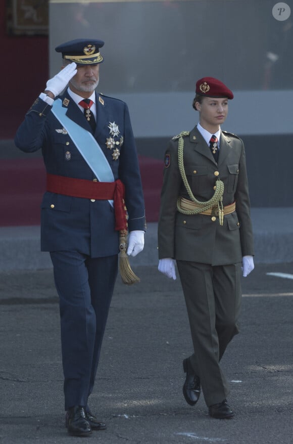 King Felipe VI and Princess of Asturias, Leonor, on their arrival at the parade on October 12 'National Day', at the Plaza de Canovas del Castillo, on October 12, 2023, in Madrid (Spain). The events begin with the raising of the national flag and the tribute to those who gave their lives for Spain, followed by the air and ground parades of different units in which 4,177 military personnel participate. This year is the first year in which a woman unfurls the flag by parachute. The parade changes its route and the Royal Tribune is now located in the Plaza de Neptuno. In addition, Leonor de Borbón, immersed in her military training as a cadet lady, wears her uniform after two years of absence due to her studies in Wales. 