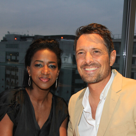 Exclusif - Hapsatou Sy et son mari Vincent Cerruti - Le Grand Dîner du 14 juillet, sur le rooftop de l'hôtel Pullman Tour Eiffel à Paris, France, le 14 juillet 2021. © Philippe Baldini/Bestimage