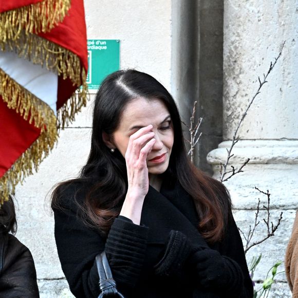 Adelina Khamaganova, ex femme de G.Marchand, Ludivine, fille de G.Marchand, son fils Balthazar lors des obsèques de Guy Marchand en l'église Saint-Pierre-ès-Liens à Mollégès le 27 décembre 2023.  Guy Marchand's funeral in the church of Saint-Pierre-ès-Liens in Mollégès on december 27th 2023 