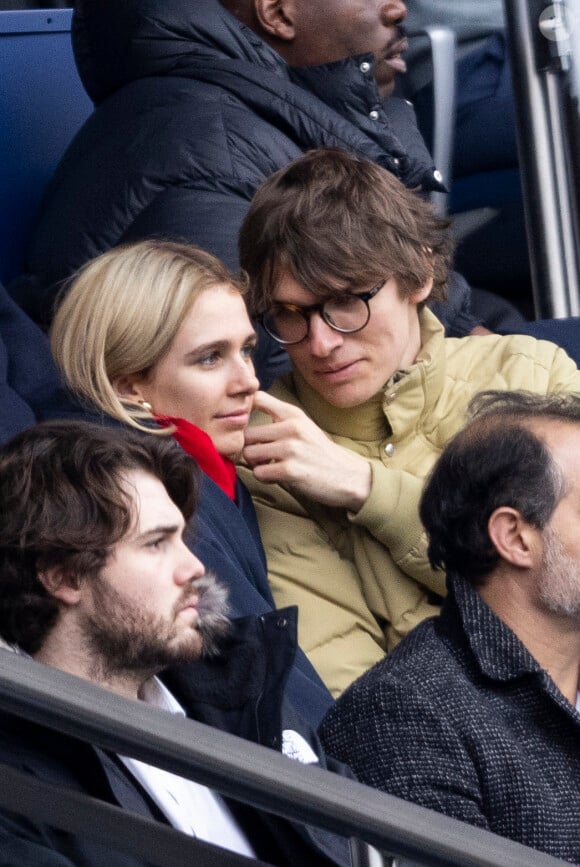 Exclusif - Pierre de Maere et une amie dans les tribunes du match de football PSG / Reims au Parc des Princes à Paris le 10 mars 2024.