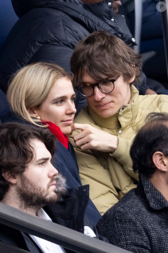 Exclusif - Pierre de Maere et une amie dans les tribunes du match de football PSG / Reims au Parc des Princes à Paris le 10 mars 2024.