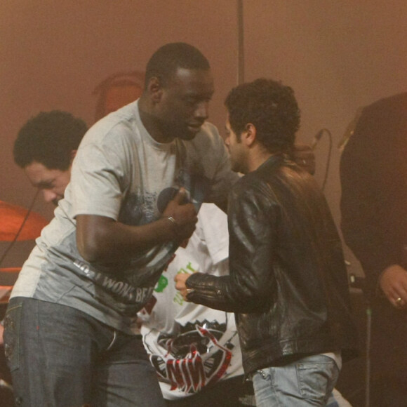 Les deux hommes ont grandi dans le même quartier de Trappes
Kassav, Omar Sy, Jamel Debbouze et Fred Testot au Bataclan - archives