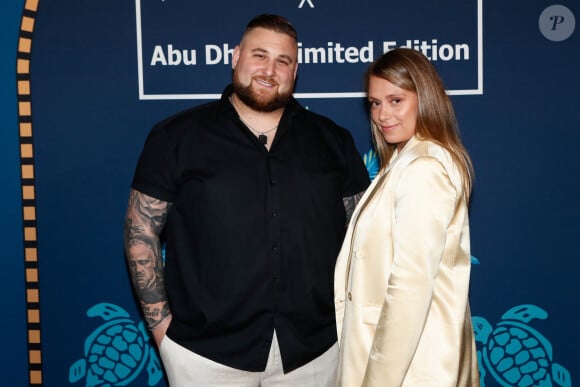 Exclusif - Nico Capone et sa compagne Daniela à la soirée de lancement de la collection capsule "Vilebrequin x Abu Dhabi limited édition" à la plage Vilebrequin (plage ondine) lors du 77ème Festival International du Film de Cannes le 14 mai 2024. © Christophe Clovis/Bestimage