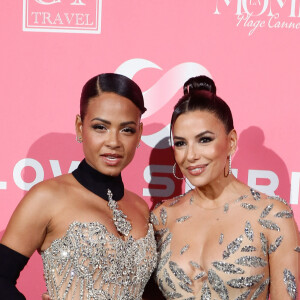 Les ornements de leurs robes respectives se sont emmêlés !
Christina Milian, Eva Longoria - Soirée de Gala "Global Gift" à la plage la Môme lors du 77ème Festival International du Film de Cannes le 19 mai 2024. © Christophe Clovis / Bestimage