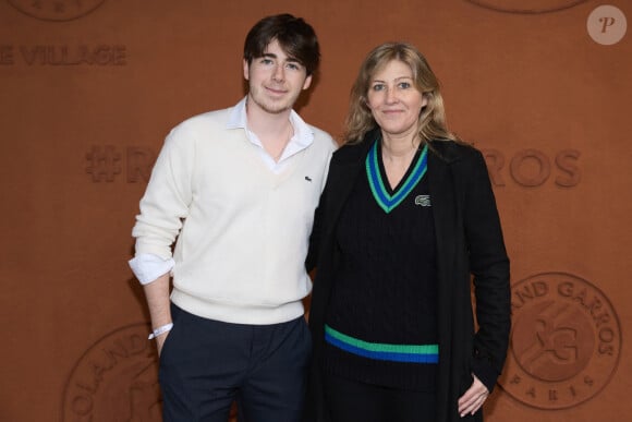 Amanda Sthers et son fils Oscar Bruel au village (night session) lors des Internationaux de France de tennis de Roland Garros 2024, à Paris, France, le 31 mai 2024. © Jacovides-Moreau/Bestimage  Celebs at the Village (night session) during the 2024 French Open at Roland Garros in Paris, France, on May 31, 2024.