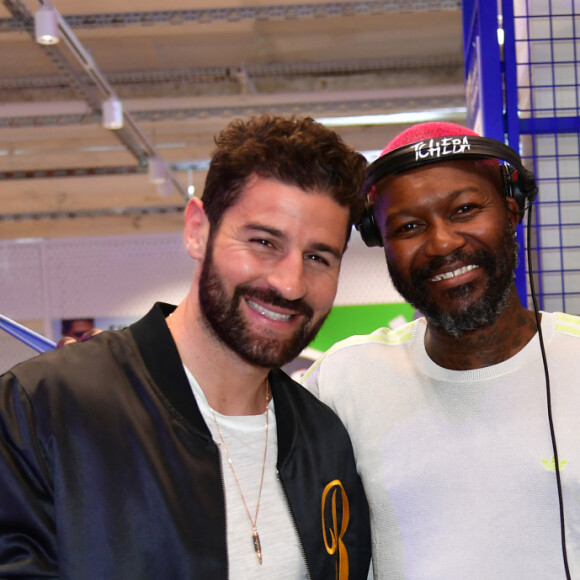 Cyril Benzaquen et Djibril Cissé lors de l'inauguration d'un magasin Intersport Paris République à Paris le 5 juin 2024. © Veeren / Bestimage 