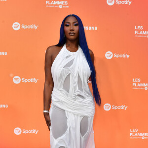 Aya Nakamura pendant le photocall de la 2ème édition de la cérémonie des Flammes, victoires du rap et de ses courants, au théâtre du Châtelet à Paris, France, le 25 avril 2024