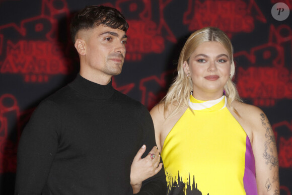 Sur ses réseaux, Florian Rossi a partagé une grande nouvelle à sa communauté.
Florian Rossi et sa compagne Louane Emera lors de la 23ème édition des NRJ Music Awards 2021 au Palais des Festivals de Cannes, le 20 novembre 2021. © Christophe Aubert via Bestimage 